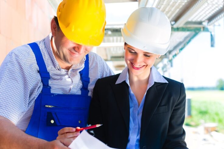 man and woman in hard hats