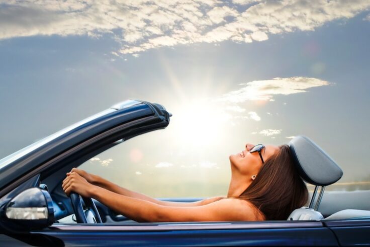 woman driving convertible